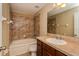 Bathroom with tub, toilet and dark brown vanity at 384 Carina Cir, Sanford, FL 32773