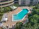 Community pool with lounge chairs and shaded areas at 4 Oceans West Blvd # 108B, Daytona Beach, FL 32118
