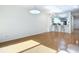 Open concept kitchen and living area with breakfast bar and hardwood floors at 4 Oceans West Blvd # 108B, Daytona Beach, FL 32118