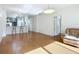 Open concept kitchen and living area with breakfast bar and hardwood floors at 4 Oceans West Blvd # 108B, Daytona Beach, FL 32118