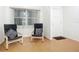 Living room with two armchairs and hardwood floors at 4 Oceans West Blvd # 108B, Daytona Beach, FL 32118