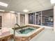 Community hot tub with tiled surround at 4 Oceans West Blvd # 108B, Daytona Beach, FL 32118