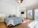 Comfortable bedroom with hardwood floors and mirrored closet at 4 Oceans West Blvd # 108B, Daytona Beach, FL 32118