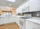 Well-equipped kitchen featuring white appliances and cabinetry at 4 Oceans West Blvd # 108B, Daytona Beach, FL 32118