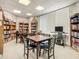 Community library with tables and chairs at 4 Oceans West Blvd # 108B, Daytona Beach, FL 32118