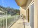 Private balcony with metal railing, overlooking lush greenery at 4 Oceans West Blvd # 108B, Daytona Beach, FL 32118
