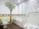 Bathroom with a large shower, garden tub, and palm tree mural at 4 Oceans West Blvd # 108B, Daytona Beach, FL 32118
