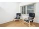 Cozy office space with two comfortable armchairs and wood floors at 4 Oceans West Blvd # 108B, Daytona Beach, FL 32118