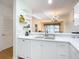 White kitchen features double sink, dishwasher, and ample cabinetry at 4 Oceans West Blvd # 108B, Daytona Beach, FL 32118