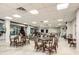 Community room with tables and chairs, perfect for gatherings at 4 Oceans West Blvd # 108B, Daytona Beach, FL 32118