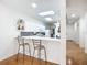 Modern kitchen with white cabinets and breakfast bar at 4 Oceans West Blvd # 108B, Daytona Beach, FL 32118