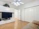 Bedroom with TV, built-in shelving, and hardwood floors at 4 Oceans West Blvd # 108B, Daytona Beach, FL 32118