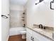 Bathroom with granite countertop, tub, and updated vanity at 425 Sandy Bluff Trl, Deland, FL 32724