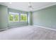 Light green bedroom with carpet and ceiling fan at 425 Sandy Bluff Trl, Deland, FL 32724