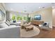 Bright living room featuring a comfy sectional sofa and stylish coffee table at 425 Sandy Bluff Trl, Deland, FL 32724