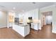 Modern kitchen with large island and stainless steel appliances at 425 Sandy Bluff Trl, Deland, FL 32724