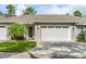 Two-car garage and front entry of charming home at 425 Sandy Bluff Trl, Deland, FL 32724