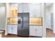 Modern kitchen with stainless steel appliances and white cabinets at 425 Sandy Bluff Trl, Deland, FL 32724
