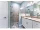 Bathroom with walk-in shower, granite countertop, and updated fixtures at 425 Sandy Bluff Trl, Deland, FL 32724