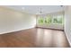 Spacious bedroom with hardwood floors and large windows at 425 Sandy Bluff Trl, Deland, FL 32724