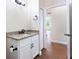 Guest bathroom with granite vanity and updated fixtures at 425 Sandy Bluff Trl, Deland, FL 32724