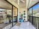 Spacious screened porch with tiled floor and ceiling fan at 600 N Boundary Ave # 106D, Deland, FL 32720