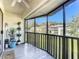 Relaxing screened porch with plants and tiled floor at 600 N Boundary Ave # 106D, Deland, FL 32720
