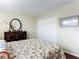 Spacious bedroom with floral bedding and large closet at 600 N Boundary Ave # 106D, Deland, FL 32720