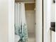 Clean bathroom with a shower/tub and white tiled walls at 600 N Boundary Ave # 106D, Deland, FL 32720
