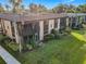 Tan condo building with brown accents and a balcony at 600 N Boundary Ave # 106D, Deland, FL 32720