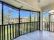 Screened porch with tiled floor and view of the community at 600 N Boundary Ave # 106D, Deland, FL 32720