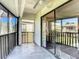 Screened porch with tiled floor, sliding glass doors, and ceiling fan at 600 N Boundary Ave # 106D, Deland, FL 32720