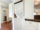 Stackable washer and dryer tucked away in a kitchen closet at 600 N Boundary Ave # 106D, Deland, FL 32720
