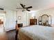 Spacious bedroom with wood floors, a ceiling fan, and ample closet space at 600 N Boundary Ave # 106D, Deland, FL 32720