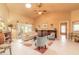 Bright living room features vaulted ceilings, comfy seating, and a large window at 6225 Cranberry Dr, Port Orange, FL 32127
