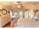 Main bedroom with hardwood floors and ensuite bathroom access at 6225 Cranberry Dr, Port Orange, FL 32127