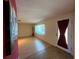 Living area with hardwood floors and access to front door at 1008 Wilmington Dr, Deltona, FL 32725