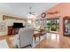 Living room with hardwood floors, large window, and view of canal at 117 Wood Ibis Ct, Daytona Beach, FL 32119