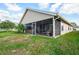 Single story home with a screened porch and backyard at 117 Wood Ibis Ct, Daytona Beach, FL 32119
