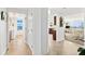 Hallway view of kitchen, living room and laundry room at 1900 N Atlantic Ave # 1601, Daytona Beach, FL 32118