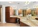 Double vanity bathroom with granite countertops at 1900 N Atlantic Ave # 1601, Daytona Beach, FL 32118