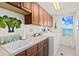 Laundry room with ocean view and built-in cabinets at 1900 N Atlantic Ave # 1601, Daytona Beach, FL 32118