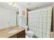 Bathroom with shower/tub combo and granite vanity at 1900 N Atlantic Ave # 1601, Daytona Beach, FL 32118