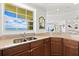 Kitchen with double sink, granite counters, and ocean views at 1900 N Atlantic Ave # 1601, Daytona Beach, FL 32118