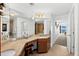 Double vanity bathroom with granite countertop, and a large mirror at 1900 N Atlantic Ave # 1601, Daytona Beach, FL 32118