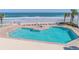 Community pool with ocean views and lounge chairs at 1900 N Atlantic Ave # 1601, Daytona Beach, FL 32118