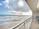 Oceanfront balcony with patio furniture and stunning view at 3333 S Atlantic Ave # 605, Daytona Beach Shores, FL 32118