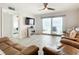 Bright living room with ocean view, leather furniture, and tiled floors at 3333 S Atlantic Ave # 605, Daytona Beach Shores, FL 32118