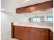 Kitchen boasts a breakfast bar with granite countertop at 3333 S Atlantic Ave # 605, Daytona Beach Shores, FL 32118