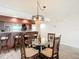 Bright dining area with glass table and wicker chairs at 3333 S Atlantic Ave # 605, Daytona Beach Shores, FL 32118